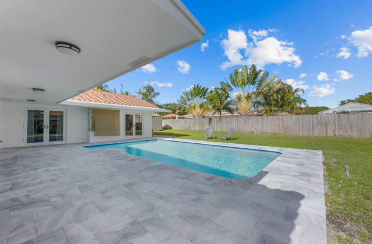 Enjoy resort-style living in this stunning home featuring a sparkling pool, expansive covered patio, and a lush, private backyard—perfect for relaxing or entertaining.