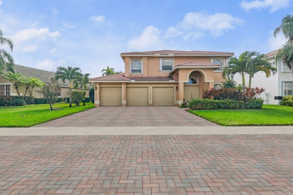 Located in a gated community near world-class equestrian centers, this stunning home boasts an expansive floorplan, top-rated schools, and a breathtaking pool with serene lake views.